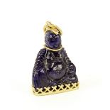 Small blue coloured stone Buddha pendant within gilt metal mount, 1.5" high