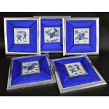 Five Chinese blue and white porcelain square tiles depicting figures in traditional landscapes, each