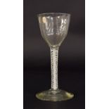 18th century drinking glass, the fluted circular bowl on a white opaque air-twist stem and