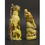 Japanese ivory okimono of a gentleman in full coloured dress holding a staff and a deer at his side,