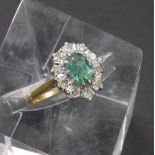 18ct emerald and diamond oval cluster ring, 14mm x 11mm, emerald 0.60ct approx, diamonds 0.10ct