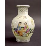 Small Chinese porcelain ovoid vase, decorated with two ladies sat at a table with calligraphy in a