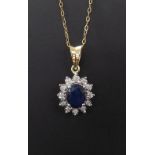 Attractive sapphire and diamond oval cluster pendant on a slender trace chain, 9ct, the pendant 26mm