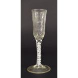 18th century drinking glass, the slender conical bowl upon a white opaque air-twist stem and