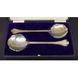 Pair of cased silver serving spoons with petal rat tail bowls, maker E S Barnsley & Co, Birmingham