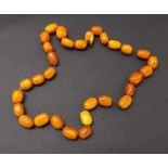 Amber oval bead necklet, each 20mm approx, 87.2gm, 26" long approx