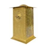 Arts & Crafts planished brass cased mantel clock, of rectangular tapered form with embossed