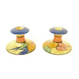 Pair of Clarice Cliff Bizarre 'Orange' Cafe-au-Lait candlesticks, 3.25" high (2)