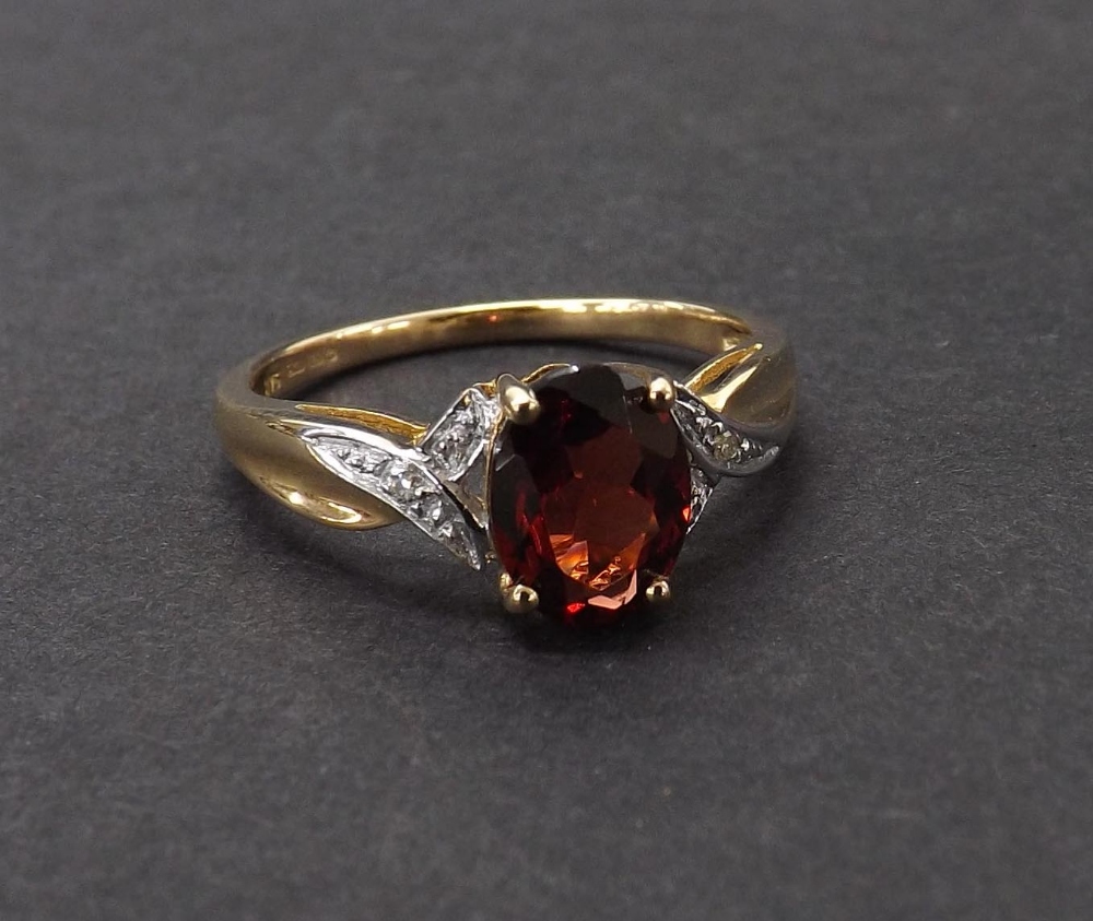 Garnet and diamond dress ring in 9ct yellow gold, 2gm, ring size L-/M