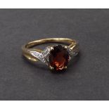Garnet and diamond dress ring in 9ct yellow gold, 2gm, ring size L-/M