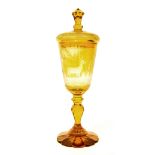 Bohemian 19th century amber overlaid glass goblet and cover, etched with stags in a traditional
