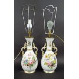 Pair of French porcelain baluster vases converted to lamps, each decorated with floral bouquets