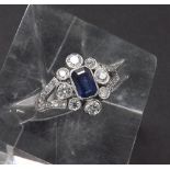 Victorian style sapphire and diamond 18ct white gold cluster ring, the emerald-cut sapphire within a