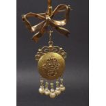 Attractive gold engine turned circular locket pendant, with filigree decoration and pearl tassels,