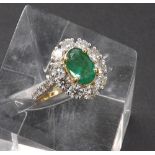 Impressive 18ct yellow gold emerald and diamond oval cluster ring, the central emerald (8mm x 5mm)