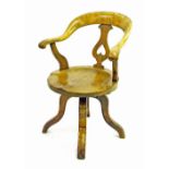 Elm seat swivel captain's armchair with a pierced vase splat, 34.5" high