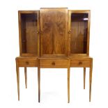 Gordon Russell - walnut veneered breakfront display cabinet, the top fitted with a single door