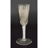 18th century drinking glass, the tapered funnel bowl etched with leaves over an opaque air-twist