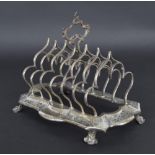 Attractive Victorian silver six-division toast rack, the shaped frame with engraved decoration