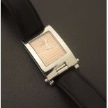 Corum Toboggan rectangular curved stainless steel wristwatch, ref. 64.151.20, no. 618001, salmon