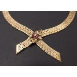 9ct necklace set with a diamond and ruby cluster, 56.1gm