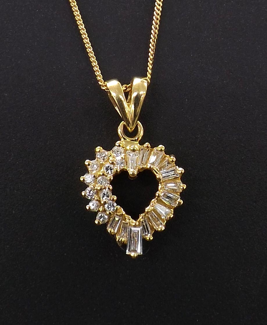 18ct diamond set open heart pendant on a slender necklet, with baguette and round brilliant-cut