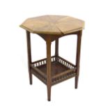 Aesthetic oak octagonal side table, with a galleried under tier on tapering legs. 24" diameter