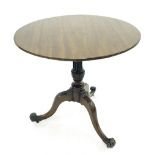 19th century mahogany tilt-top tripod table, the circular top upon a fluted and wrythen turned