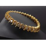 Fine 18ct yellow gold diamond set bracelet, with thirty-two round brilliant-cut diamonds,