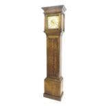 Oak thirty hour longcase clock, the 10" square brass dial with silvered chapter ring enclosing a