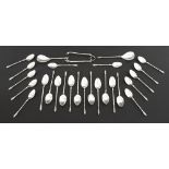 Suite of Dutch silver teaspoons comprising two sets of twelve spoons, two caddy spoons and a pair of