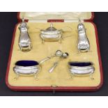 Cased silver cruet set comprising a pair of salts, lidded mustard, pair of pepper pots and three