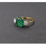 Attractive 18ct emerald and diamond three stone ring, the oval emerald 1.55ct approx, flanked by two