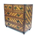 Good 19th century brass bound military chest of drawers of two sections, unusually inlaid with