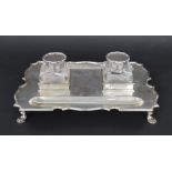 Edwardian silver inkstand, of rectangular form with a moulded cut shaped border upon corner pad