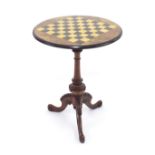 Victorian burr walnut circular tripod games table, the chequer board top upon a turned column with