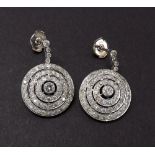 Good pair of platinum and diamond set stepped target earrings, the central stones 0.16ct approx