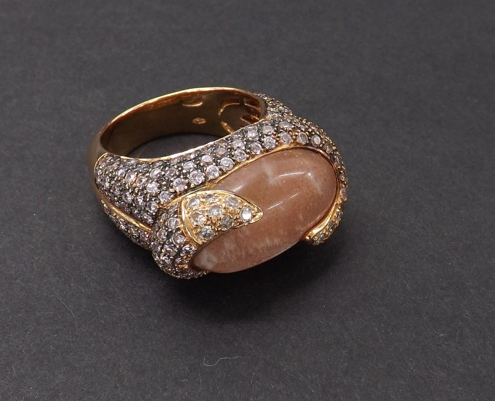 (132968-1-A) Unusual 18ct pink diamond and quartz set abstract dress ring, the oval cabochon