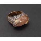 (132968-1-A) Unusual 18ct pink diamond and quartz set abstract dress ring, the oval cabochon