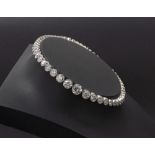 Good platinum line bracelet set with fifty-five diamonds, centre stone 0.40ct approx, 13.2gm, 7.5"