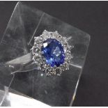 Large 18ct white gold tanzanite and diamond oval cluster ring, the tanzanite estimated 2.8ct