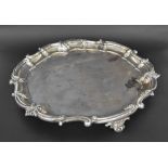 Mappin & Webb good large circular silver salver, with a scroll shaped rim upon cast paw scroll feet,