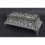 Good late Victorian silver jewellery casket, of sarcophagus form, repousse and pierced in the rococo