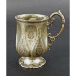 Victorian silver christening mug, with stylised foliate carved dimpled sides, London 1857, 5"