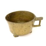 Chinese antique bronze censer type vessel, with a single handle upon tripod feet, 5.75" diameter,