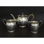 Silver three piece tea service of plain ovoid form with beaded decoration, maker Charles Boyton &
