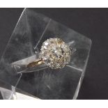18ct diamond cluster ring, the central old European-cut diamond 0.59ct approx, clarity VS/SI, colour