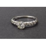 18ct white gold solitaire diamond ring, round brilliant-cut with set shoulders, 0.50ct approx,