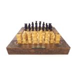 Modern Chinese carved wood chess set, in the original decorative carved folding games board/box