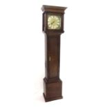 Oak thirty hour longcase clock, the 10" square brass dial with silvered chapter ring enclosing a